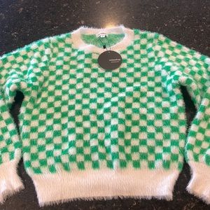 Green and white checkered sweater